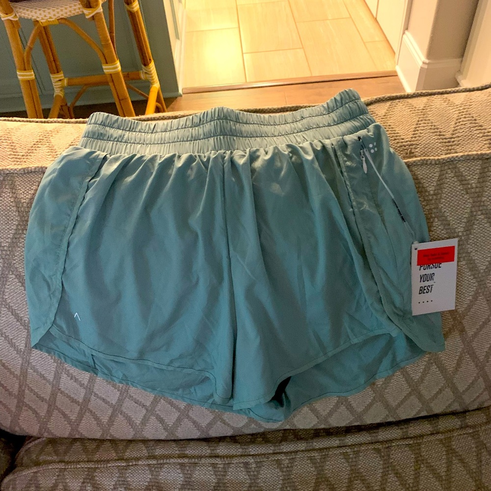 Acta workout shorts; high-waisted; new w/tags in a bluish sage green color